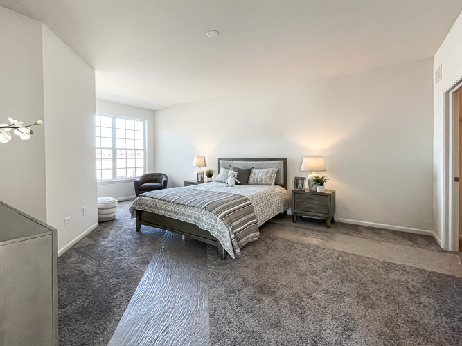 455 Ridge Lane Bolingbrook, IL 60440 - Photo 11 of 14 a spacious bedroom with a bed and a window