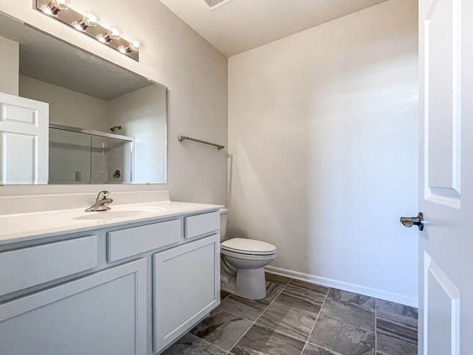 455 Ridge Lane Bolingbrook, IL 60440 - Photo 12 of 14 a bathroom with a sink mirror and toilet