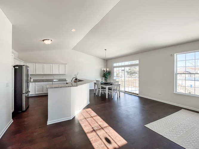 455 Ridge Lane Bolingbrook, IL 60440 - Photo 3 of 14 a open kitchen with white cabinets and stainless steel appliances