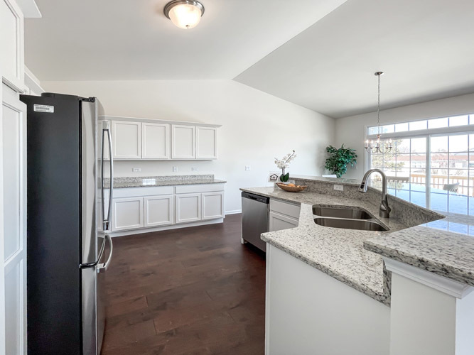 455 Ridge Lane Bolingbrook, IL 60440 - Photo 6 of 14 a kitchen with stainless steel appliances granite countertop a sink stove and refrigerator