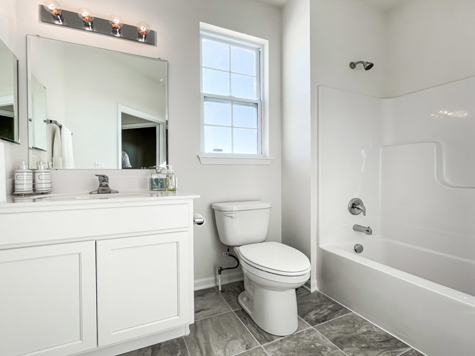 455 Ridge Lane Bolingbrook, IL 60440 - Photo 10 of 14 a bathroom with a sink toilet and shower