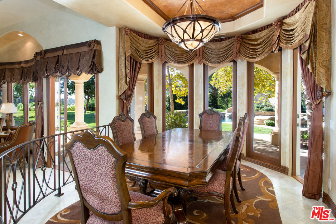 9269 Stockton Road Moorpark, CA 93021 - Photo 13 of 46 a view of a dining room with furniture wooden floor and chandelier