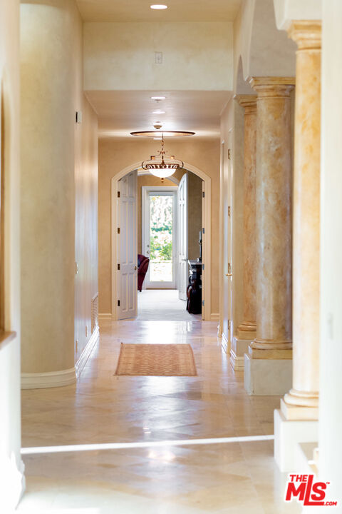 9269 Stockton Road Moorpark, CA 93021 - Photo 17 of 46 a view of a hallway view with wooden floor and living room