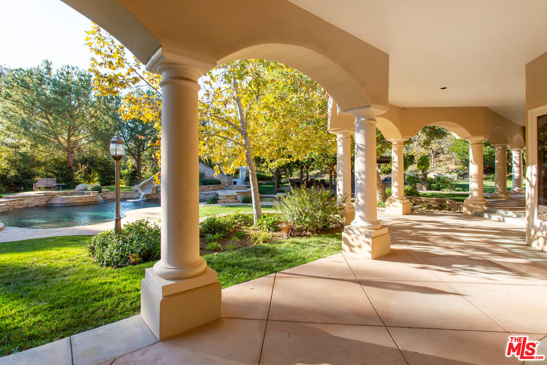 9269 Stockton Road Moorpark, CA 93021 - Photo 22 of 46 a view of a house with a backyard and a patio