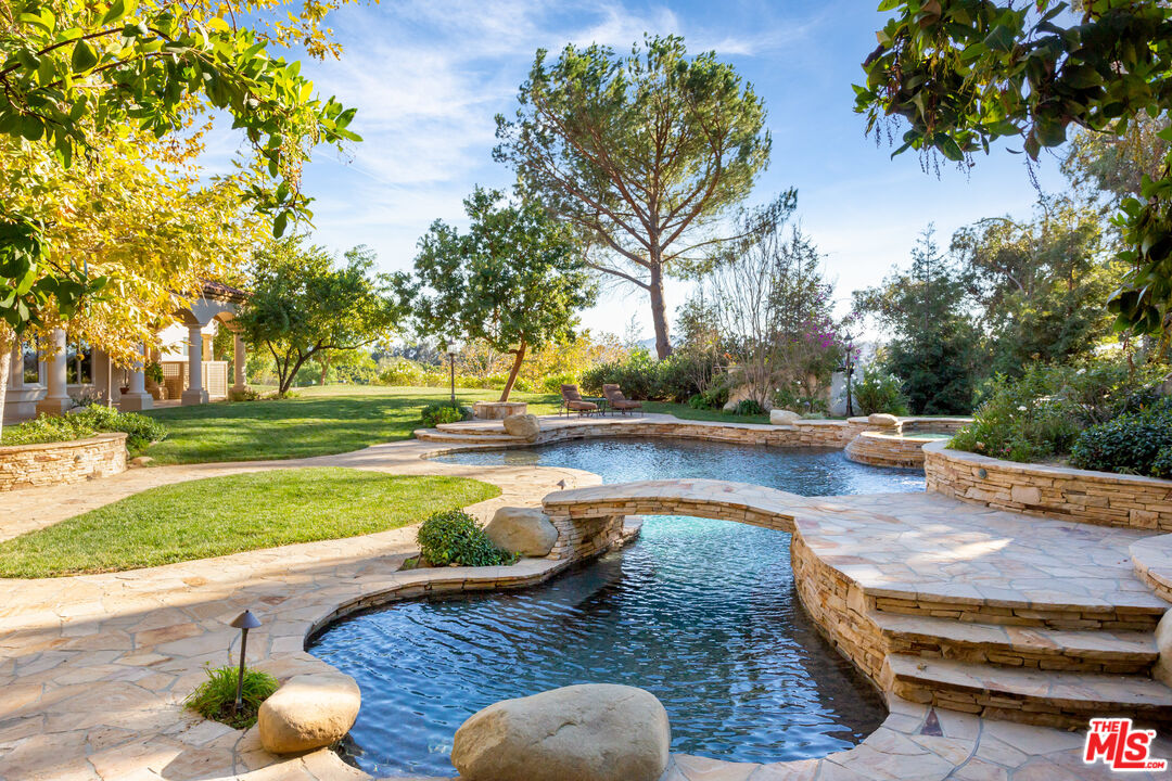 9269 Stockton Road Moorpark, CA 93021 - Photo 29 of 46 a view of a yard and swimming pool