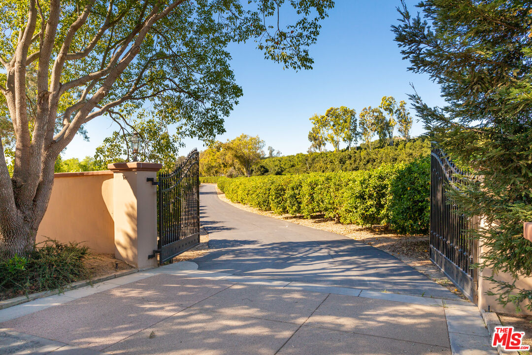 9269 Stockton Road Moorpark, CA 93021 - Photo 6 of 46 a view of a yard with plants and trees