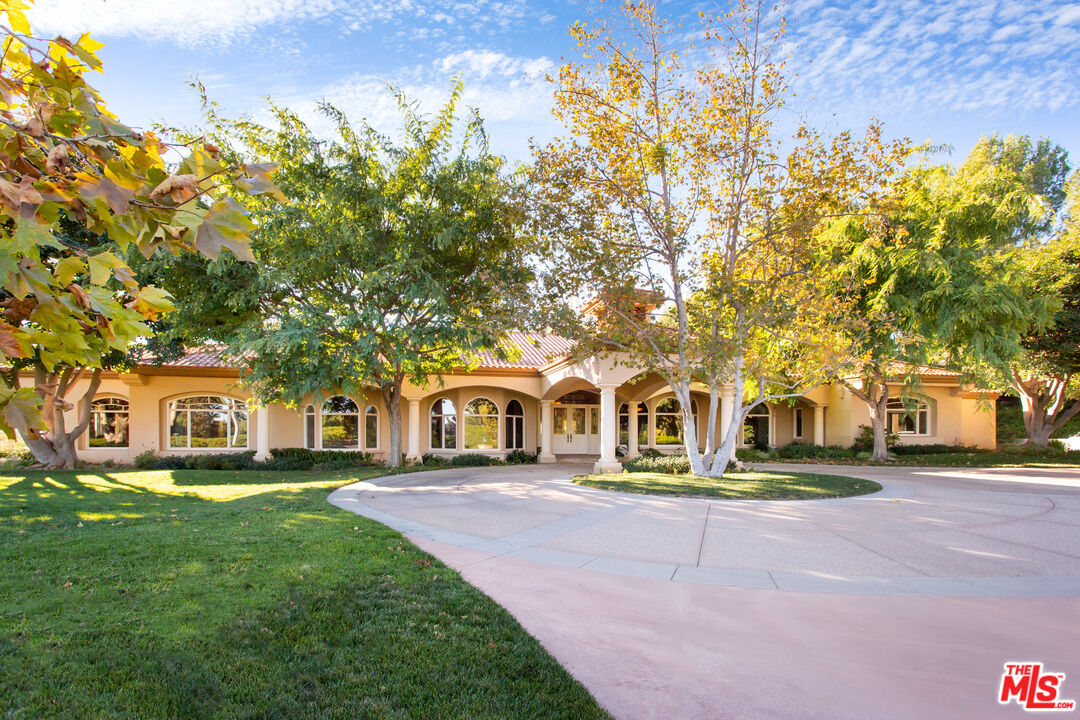 9269 Stockton Road Moorpark, CA 93021 - Photo 7 of 46 a front view of a building with a garden