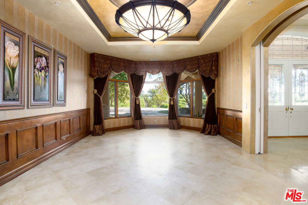 9269 Stockton Road Moorpark, CA 93021 - Photo 10 of 46 an empty room with windows and dinning table and chairs