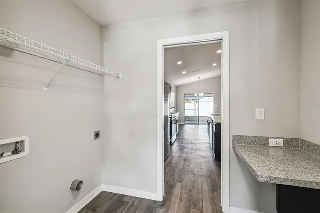 a bathroom with a granite countertop sink and shower