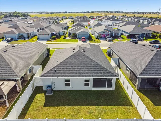 a aerial view of a house with a swimming pool