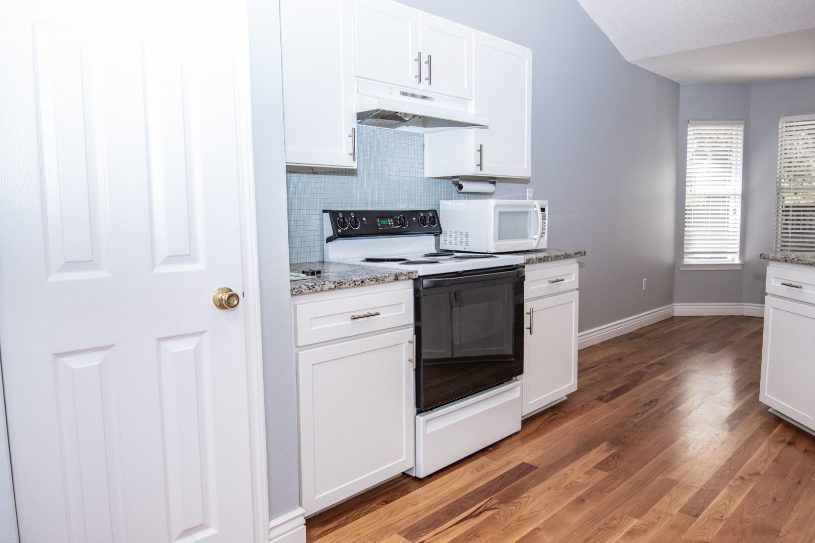 607 Risen Star Drive Crestview, FL 32539 - Photo 19 of 35 a kitchen with a stove top oven sink and cabinets