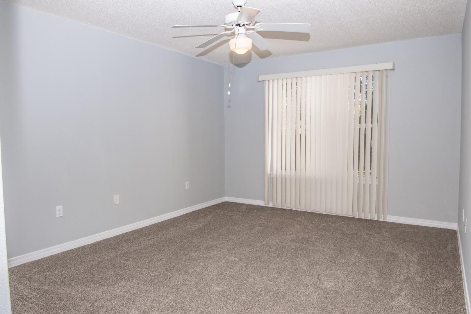 607 Risen Star Drive Crestview, FL 32539 - Photo 22 of 35 an empty room with windows and fan
