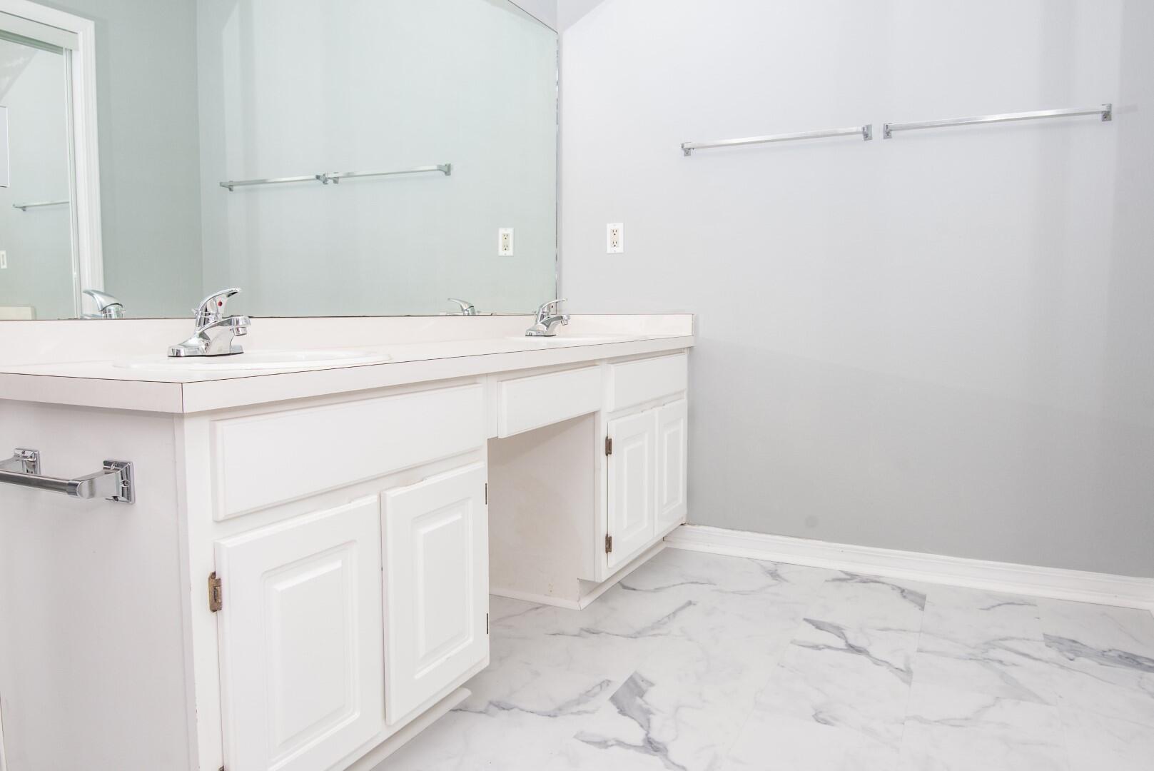 607 Risen Star Drive Crestview, FL 32539 - Photo 24 of 35 a bathroom with a sink and a mirror