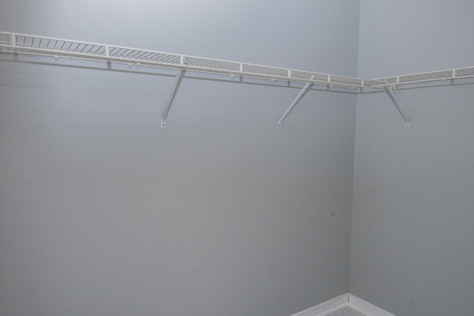 607 Risen Star Drive Crestview, FL 32539 - Photo 25 of 35 a view of a room with racks on the wall
