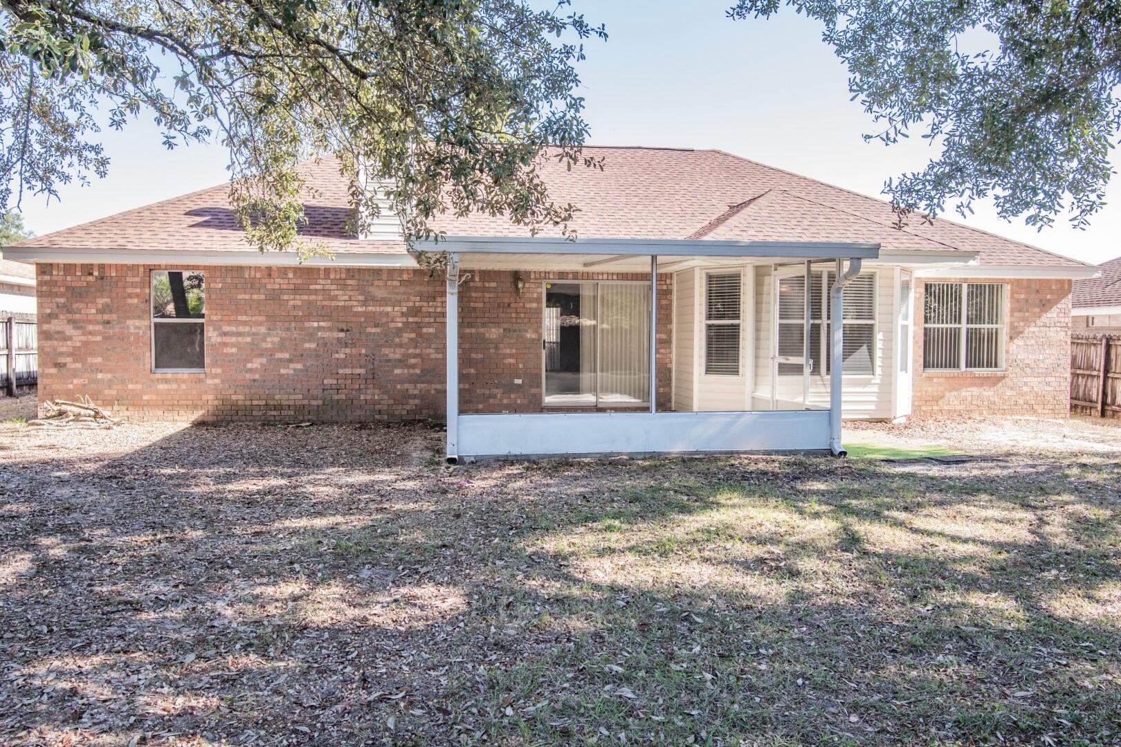 607 Risen Star Drive Crestview, FL 32539 - Photo 30 of 35 a view of a house with a yard