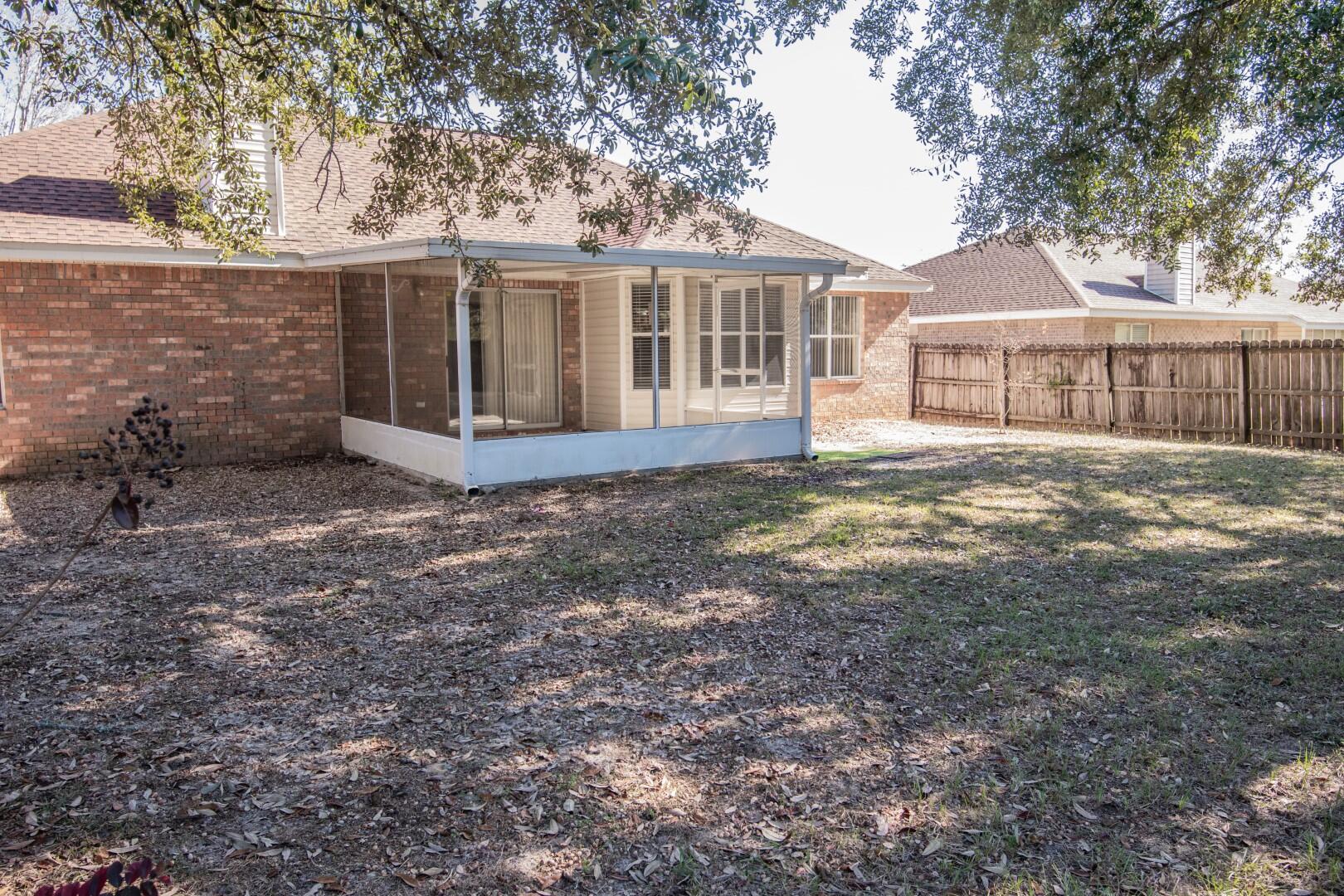607 Risen Star Drive Crestview, FL 32539 - Photo 32 of 35 a view of a house with a yard