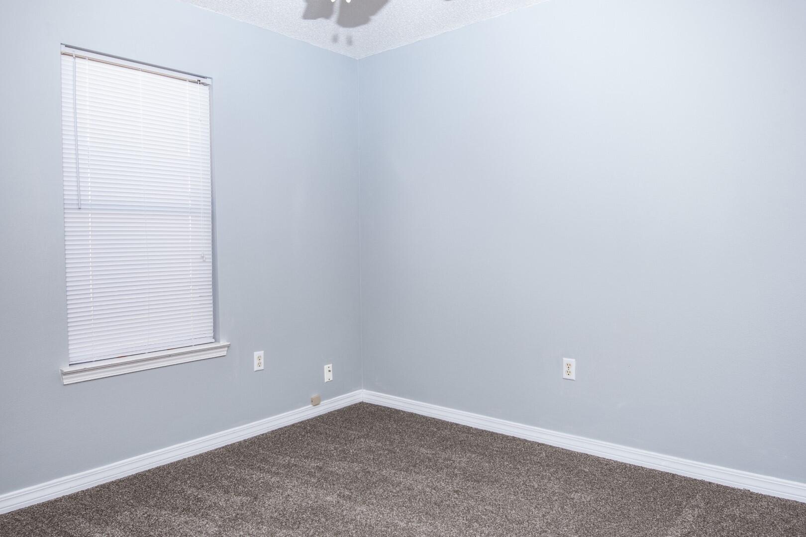607 Risen Star Drive Crestview, FL 32539 - Photo 8 of 35 an empty room with a window