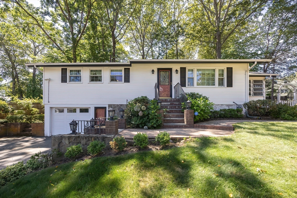 21 Trinity Drive Milford, MA 01757 - Photo 1 of 38 a view of a house with backyard and sitting area