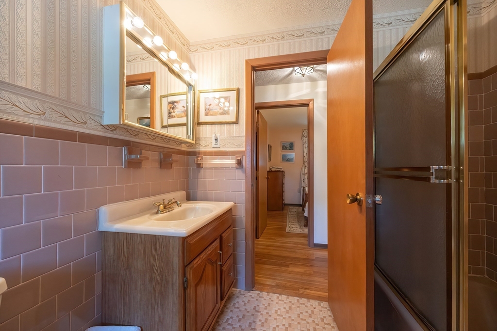 21 Trinity Drive Milford, MA 01757 - Photo 23 of 38 a bathroom with a sink and a mirror