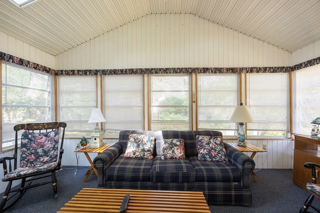 21 Trinity Drive Milford, MA 01757 - Photo 27 of 38 a living room with furniture and a floor to ceiling window