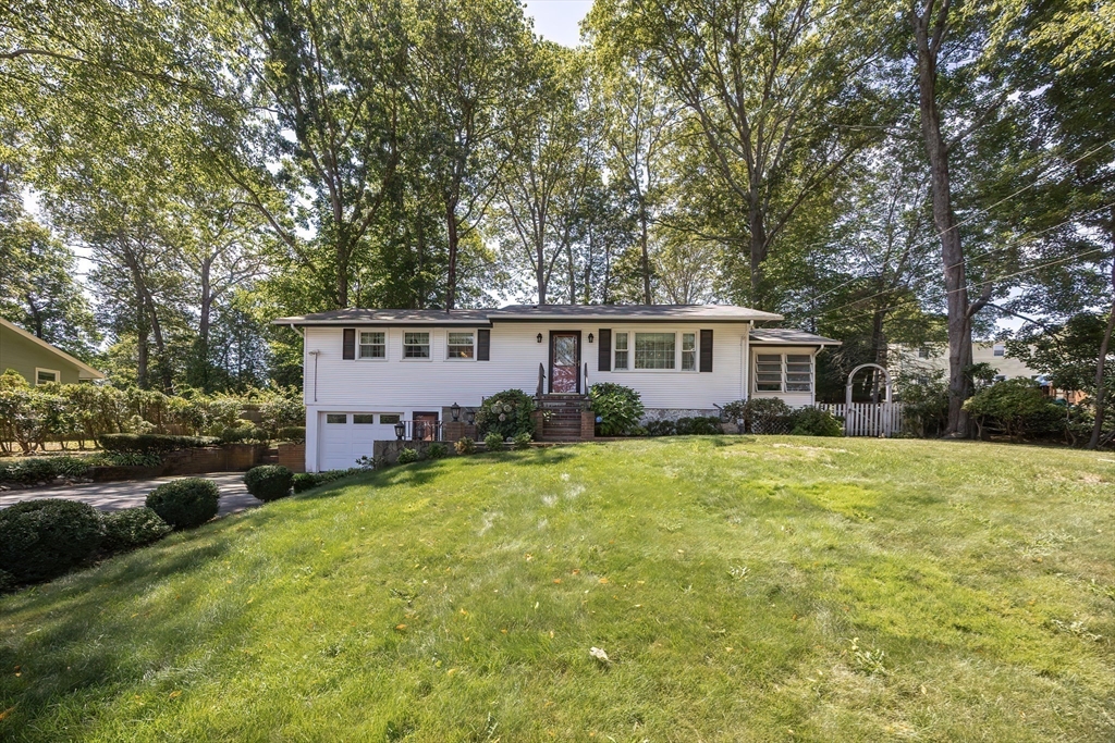 21 Trinity Drive Milford, MA 01757 - Photo 37 of 38 front view of a house with a yard