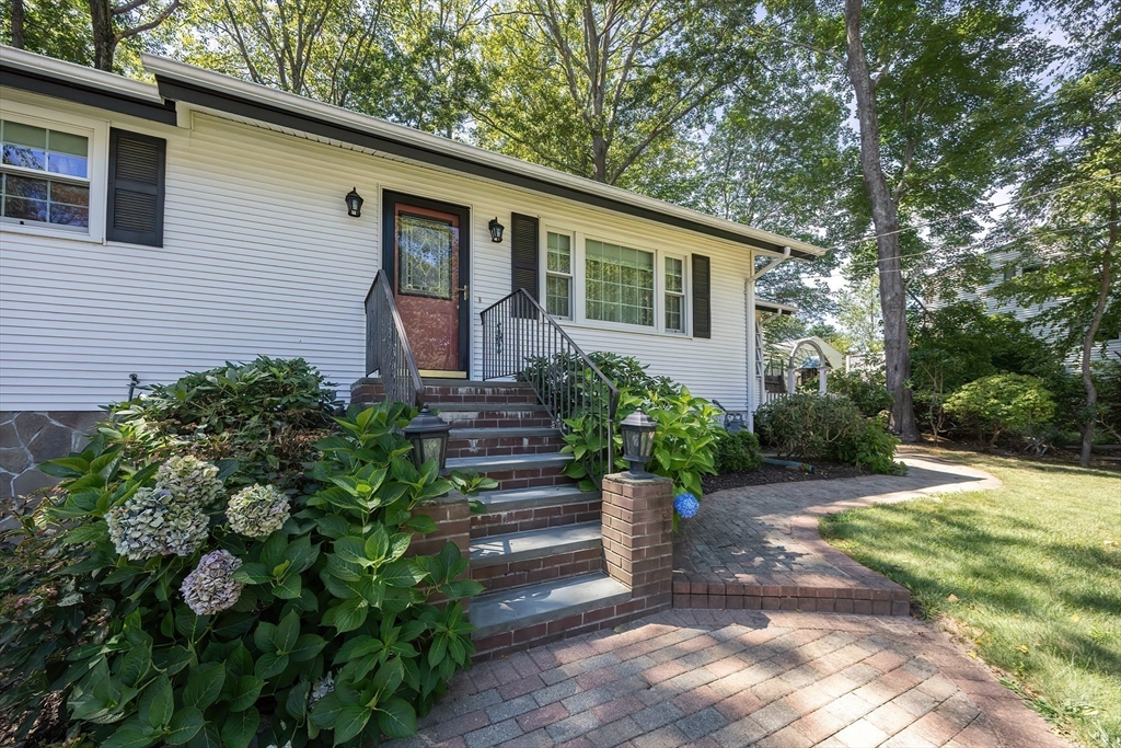 21 Trinity Drive Milford, MA 01757 - Photo 38 of 38 a front view of a house with garden