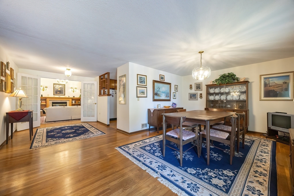 21 Trinity Drive Milford, MA 01757 - Photo 10 of 38 a living room with furniture and a table