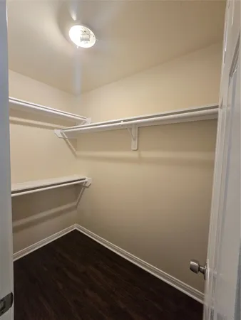 a view of an empty walk in closet