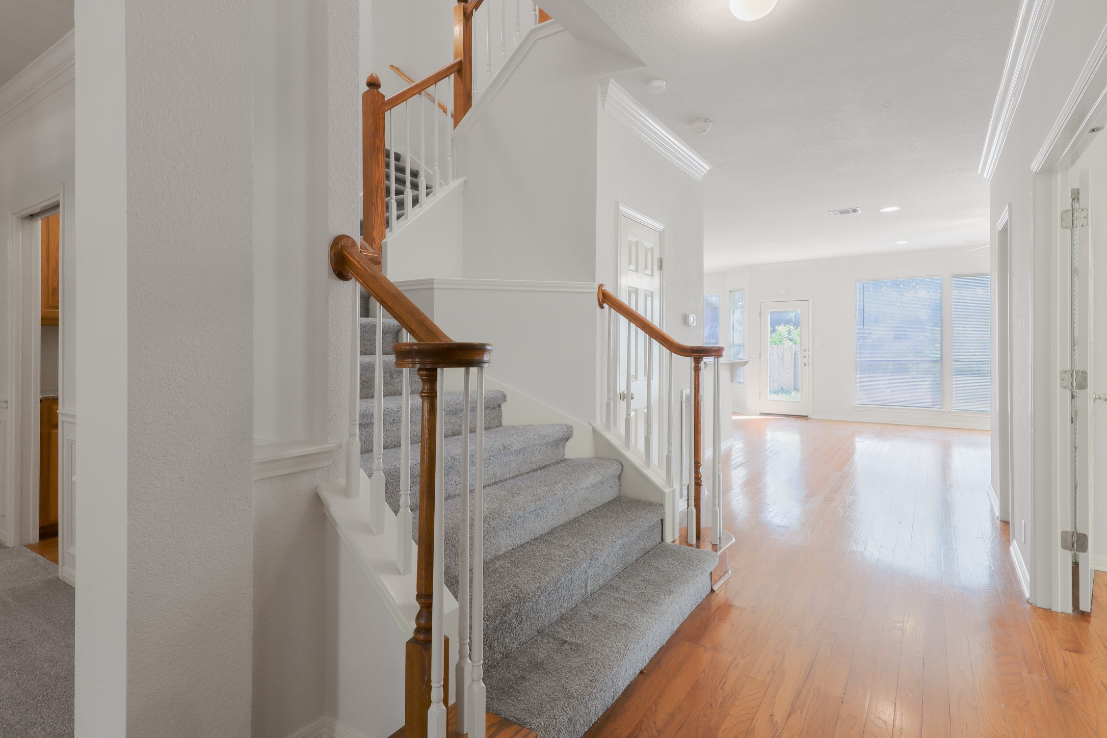 10225 Open Gate Drive Austin, TX 78726 - Photo 17 of 34 a view of entryway and hall with wooden floor