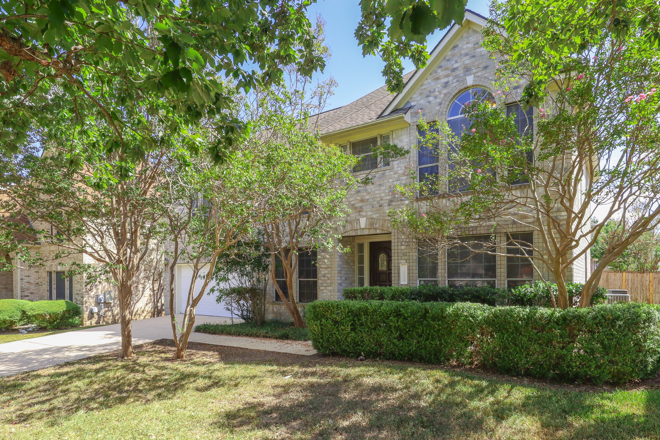 10225 Open Gate Drive Austin, TX 78726 - Photo 2 of 34 a front view of a house with a yard