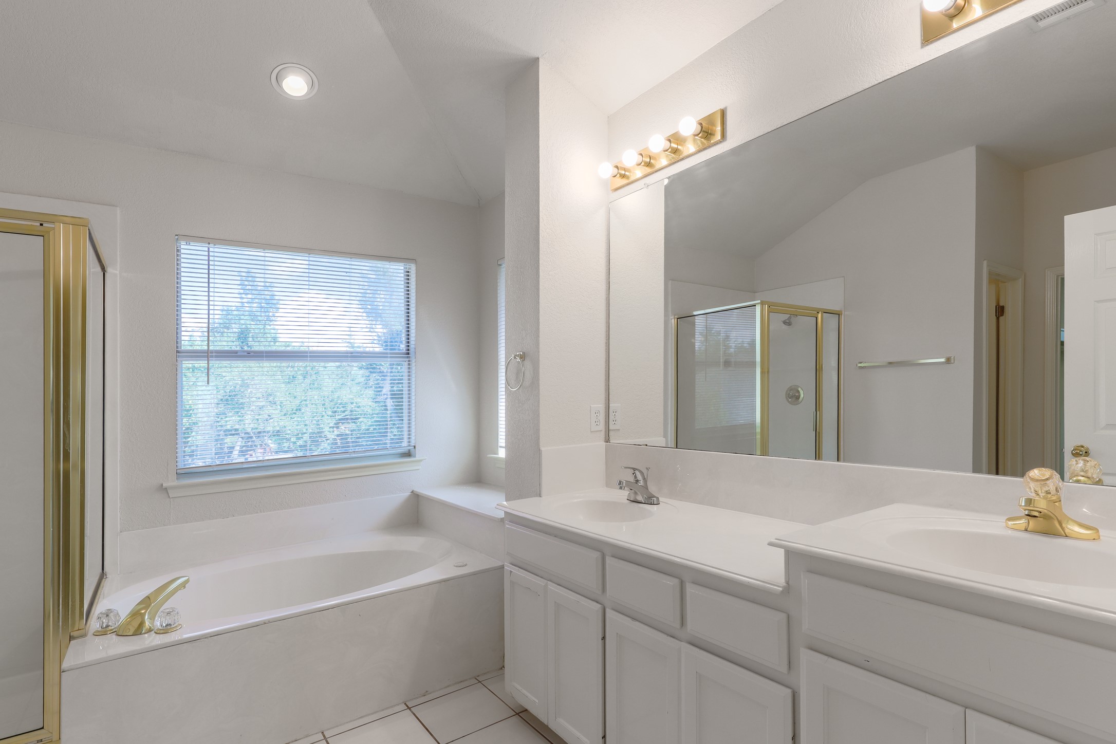 10225 Open Gate Drive Austin, TX 78726 - Photo 21 of 34 a bathroom with a large tub sink and vanity