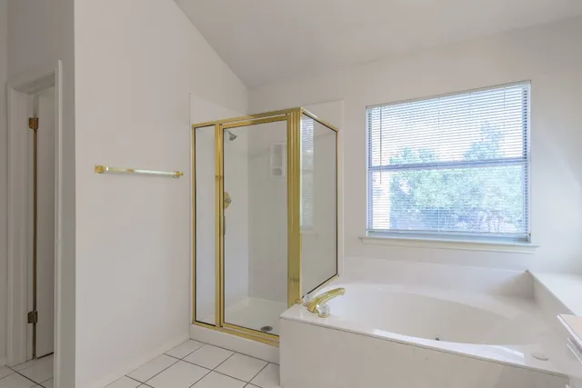 a white bath tub sitting next to a window