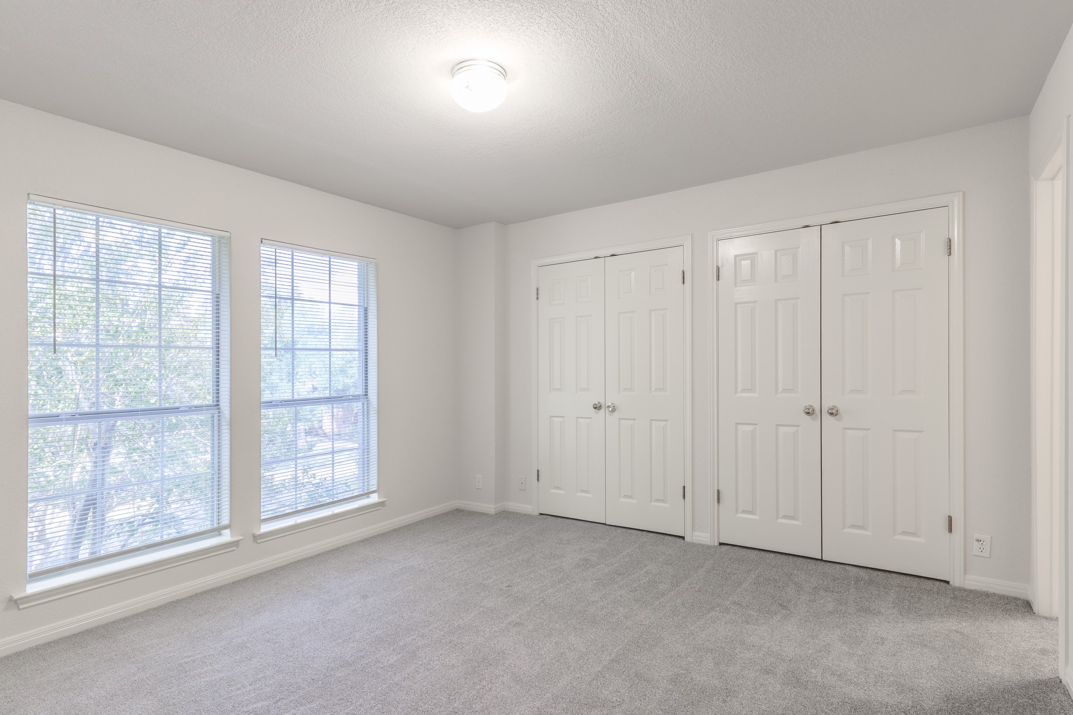 10225 Open Gate Drive Austin, TX 78726 - Photo 25 of 34 an empty room with windows and closet