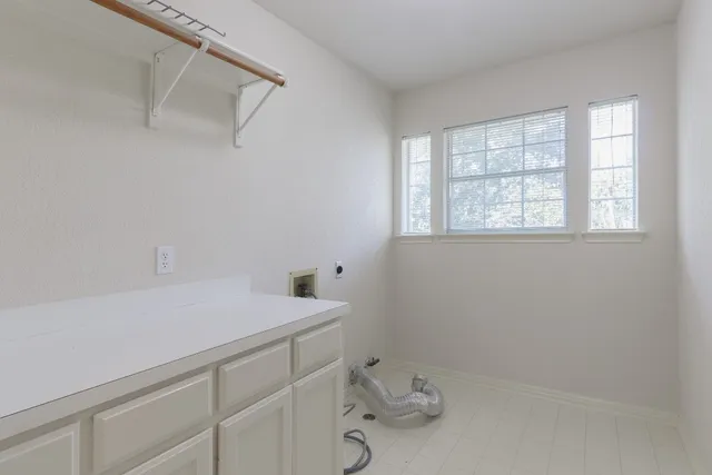 a bathroom with a sink and a window