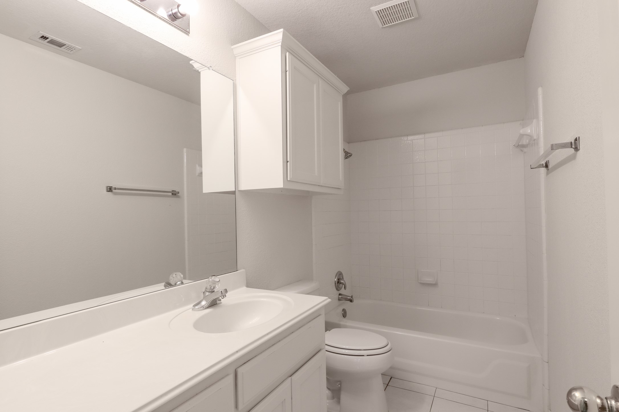 10225 Open Gate Drive Austin, TX 78726 - Photo 31 of 34 a bathroom with a sink toilet and shower