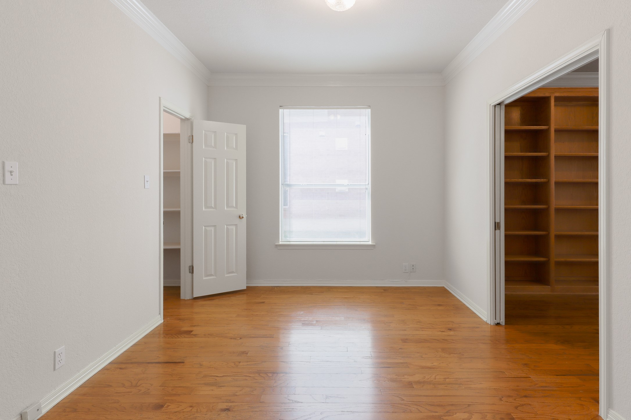 10225 Open Gate Drive Austin, TX 78726 - Photo 8 of 34 a view of an empty room with a window and wooden floor