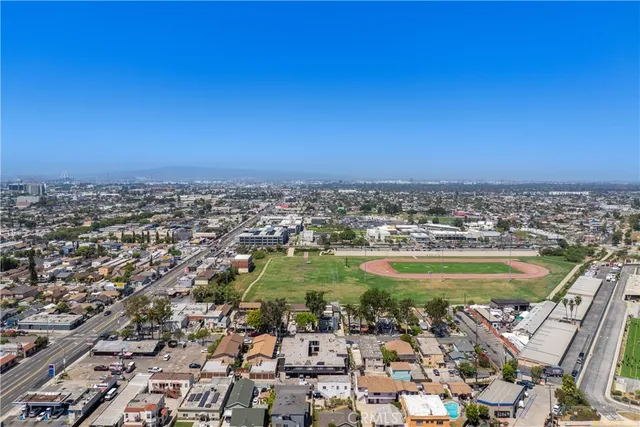 an aerial view of residential houses with outdoor space