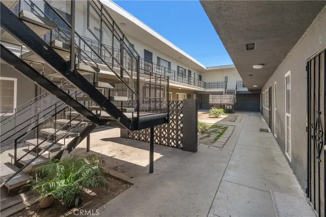 a view of a patio with a table and chairs