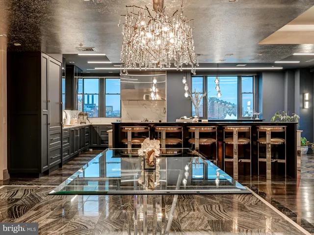 a kitchen with a stove and a refrigerator