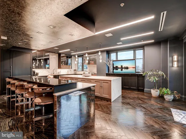 a kitchen with a table and chairs in it