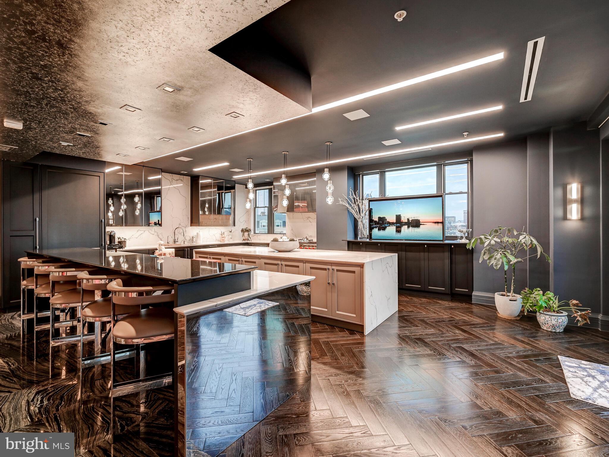 801 Key Highway, Unit P54 Baltimore, MD 21230 - Photo 14 of 81 a kitchen with stainless steel appliances granite countertop a stove and a refrigerator
