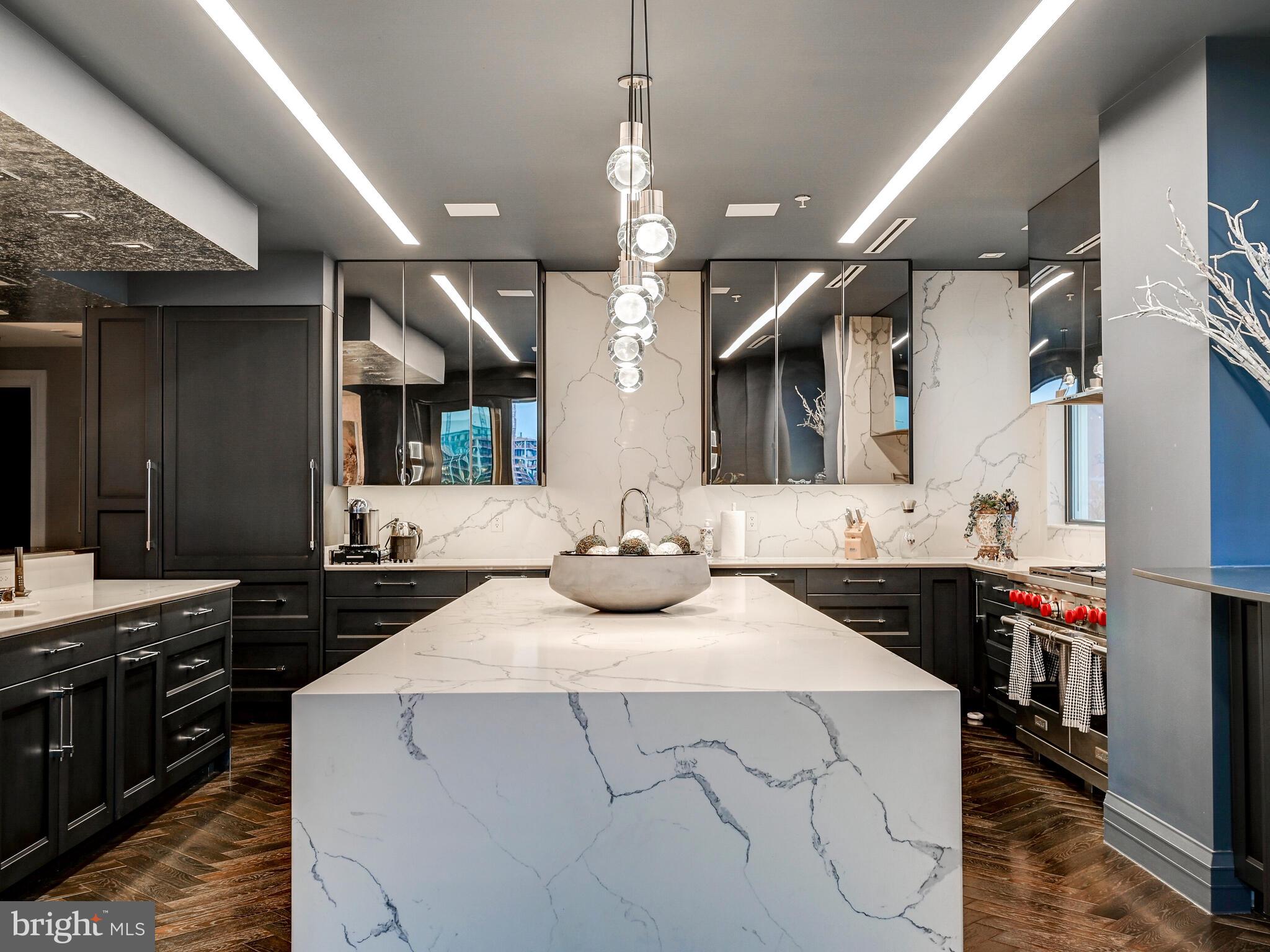 801 Key Highway, Unit P54 Baltimore, MD 21230 - Photo 18 of 81 a kitchen with a stove a sink and a refrigerator