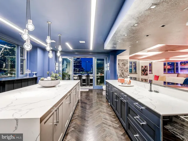 a lobby with furniture and floor to ceiling window