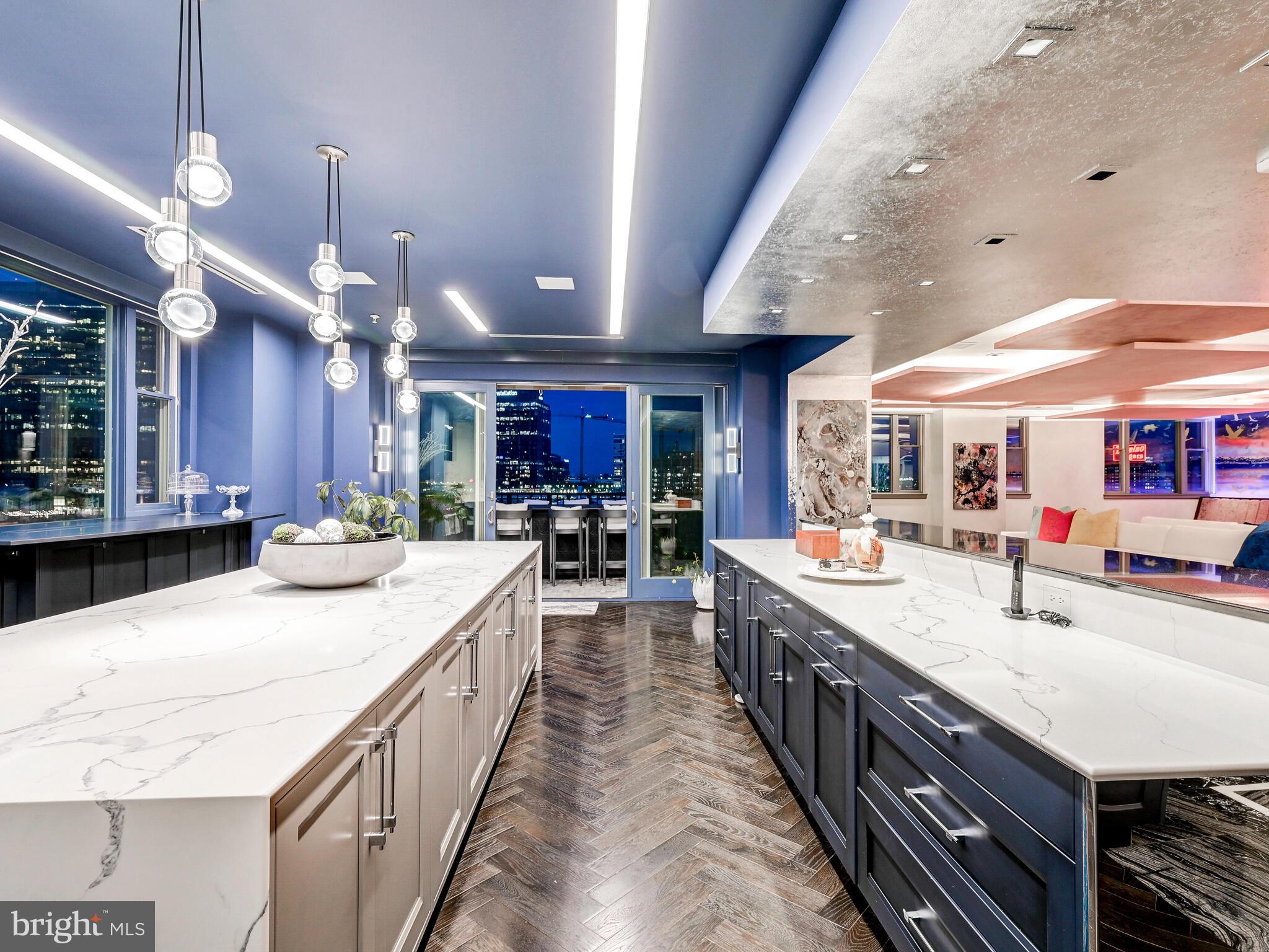 801 Key Highway, Unit P54 Baltimore, MD 21230 - Photo 23 of 81 a large kitchen with kitchen island a large island in it