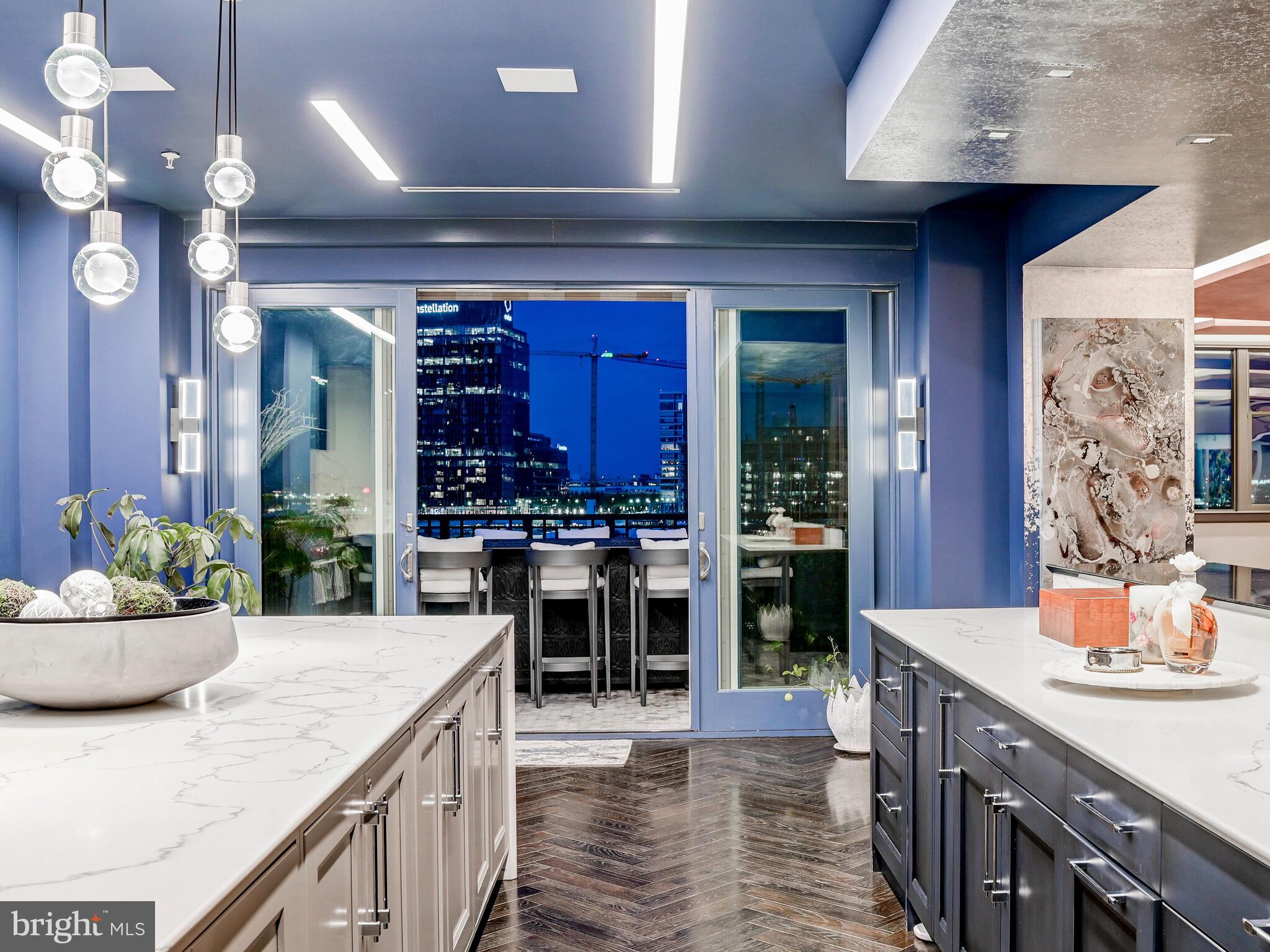 801 Key Highway, Unit P54 Baltimore, MD 21230 - Photo 24 of 81 a kitchen with a table and chairs in it