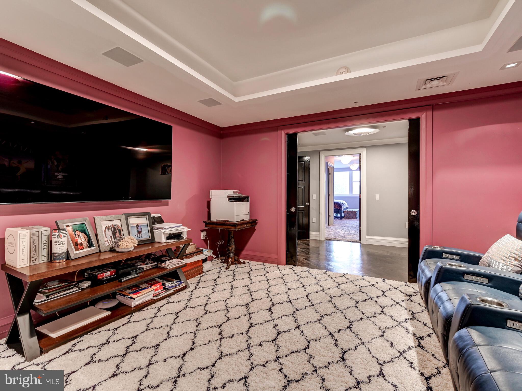 801 Key Highway, Unit P54 Baltimore, MD 21230 - Photo 44 of 81 a bedroom with furniture and flat screen tv