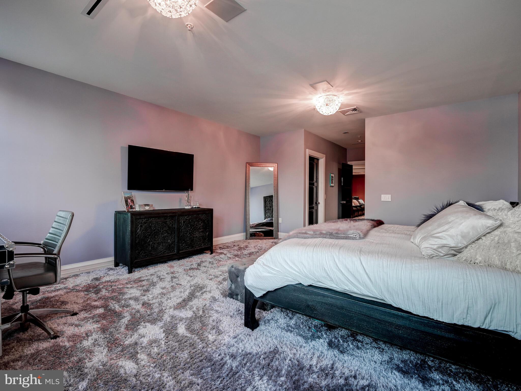 801 Key Highway, Unit P54 Baltimore, MD 21230 - Photo 46 of 81 a bedroom with a bed and a flat screen tv