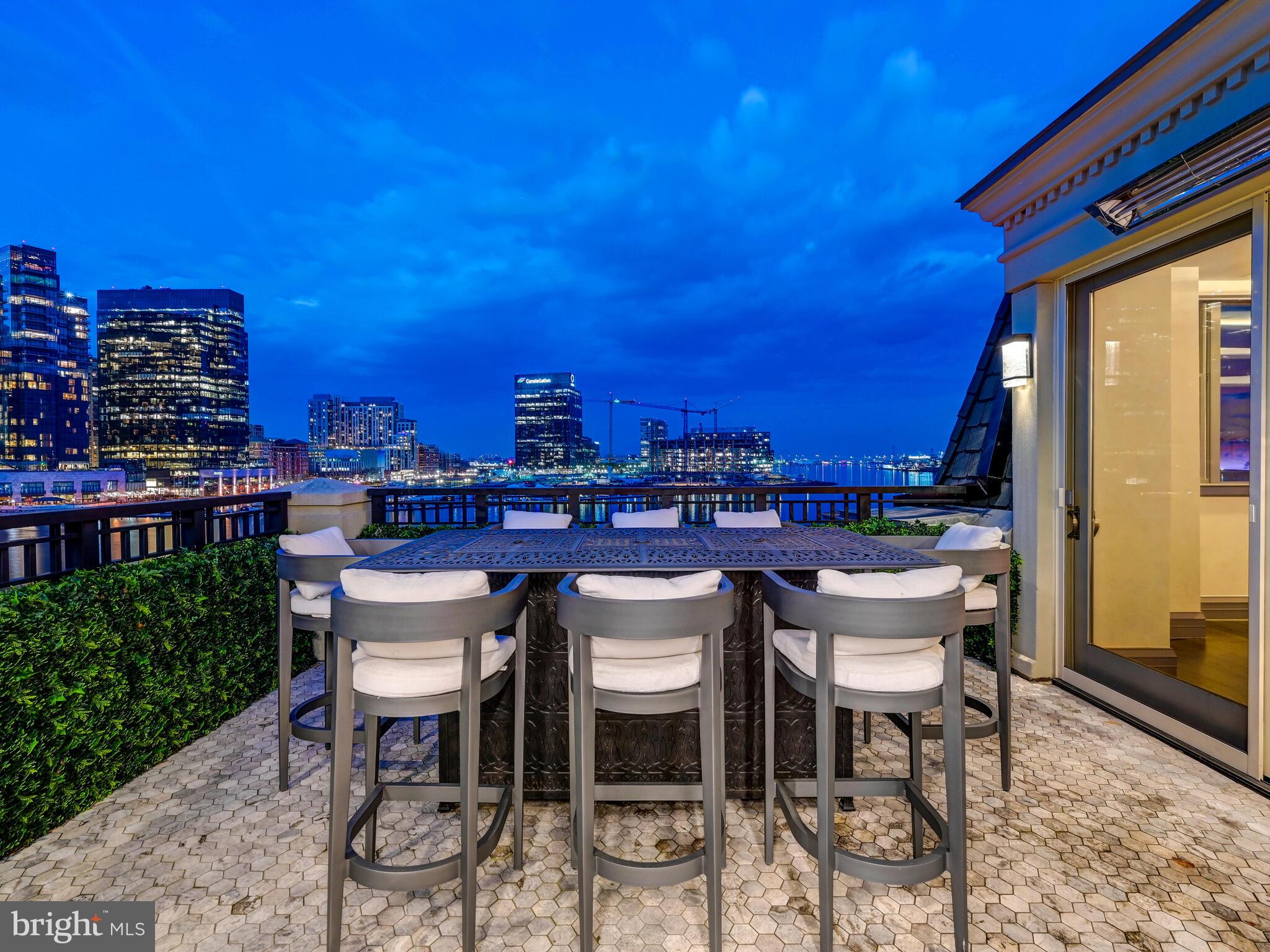 801 Key Highway, Unit P54 Baltimore, MD 21230 - Photo 63 of 81 a view of a chairs and table in a patio