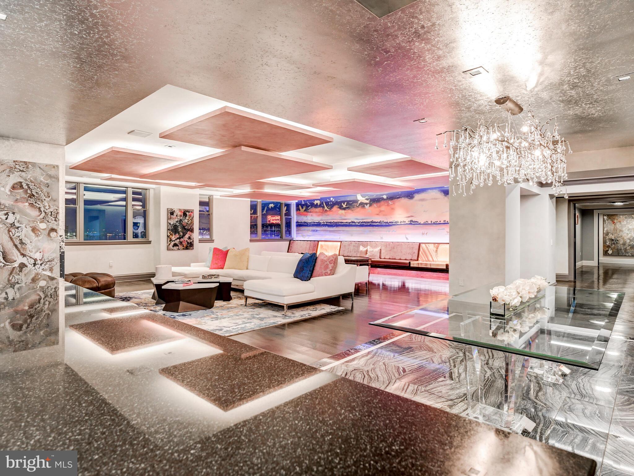 801 Key Highway, Unit P54 Baltimore, MD 21230 - Photo 10 of 81 a living room with furniture and a chandelier