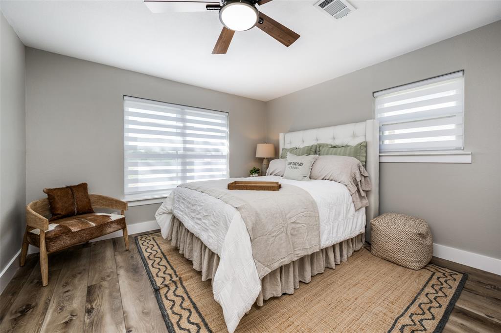 715 Stonecrest Road Argyle, TX 76226 - Photo 19 of 26 Bedroom 2 can accommodate a king size bed if needed. A queen-sized bed is currently in this room.